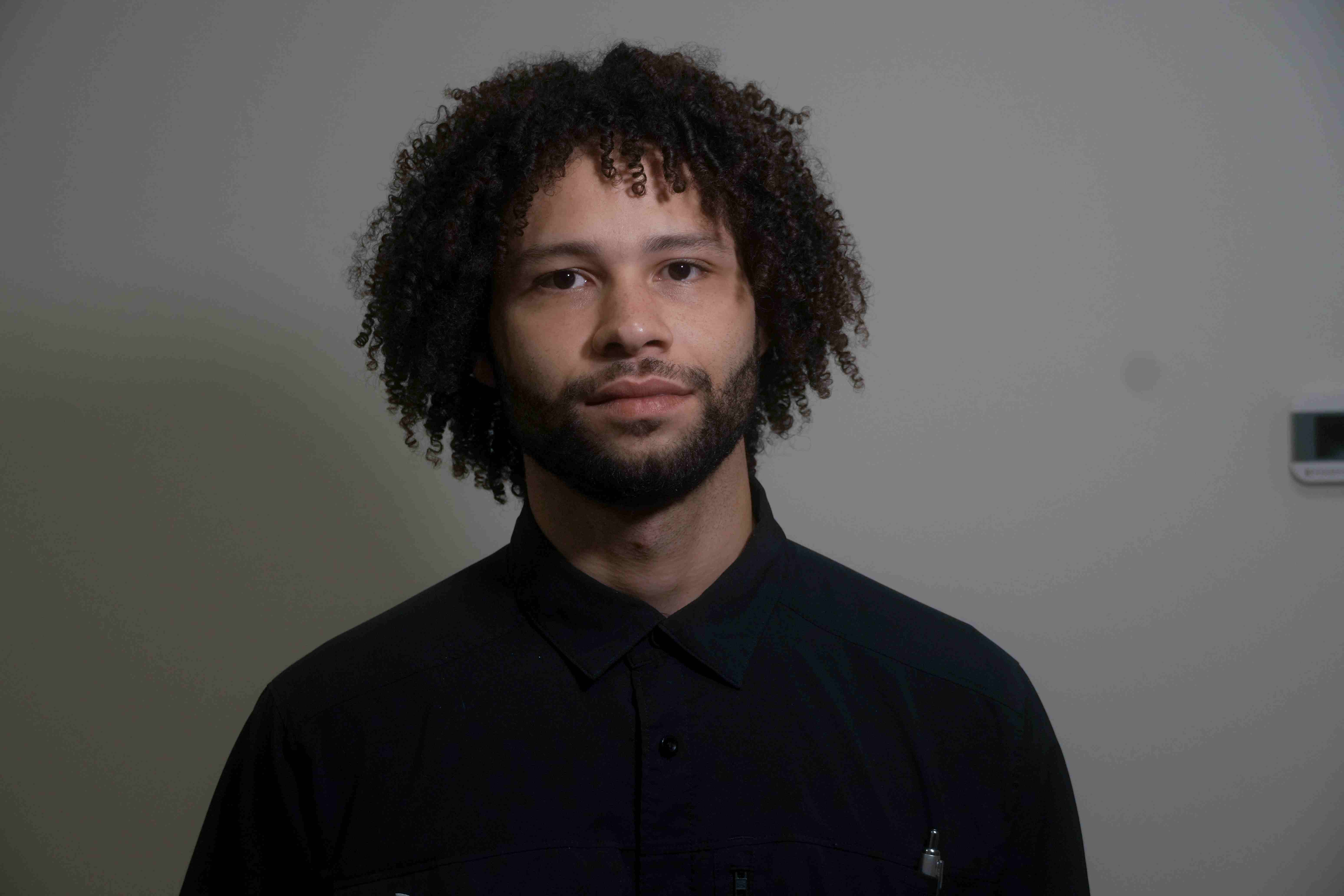 Syrus Mason, owner of Mason Mechanics, in a black work shirt